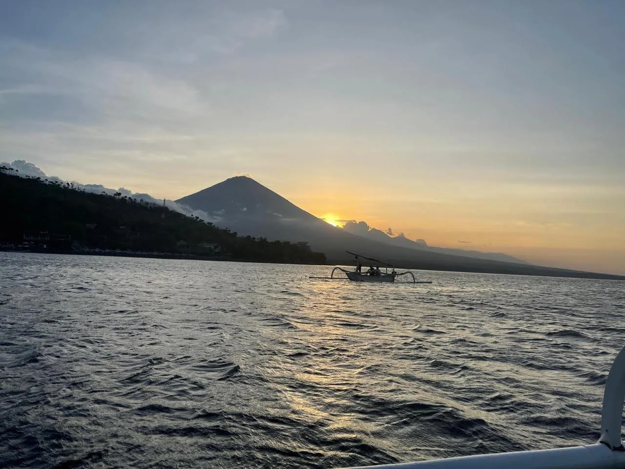 Jukung boat at sunset with Mount Agung, Amed